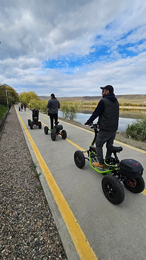 Riders on EZRider scooters on bike path