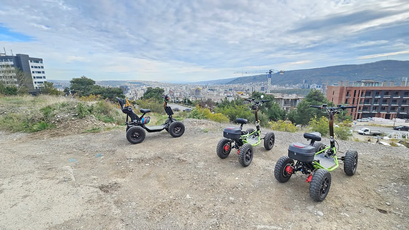 EZRider vehicles with Tbilisi city view